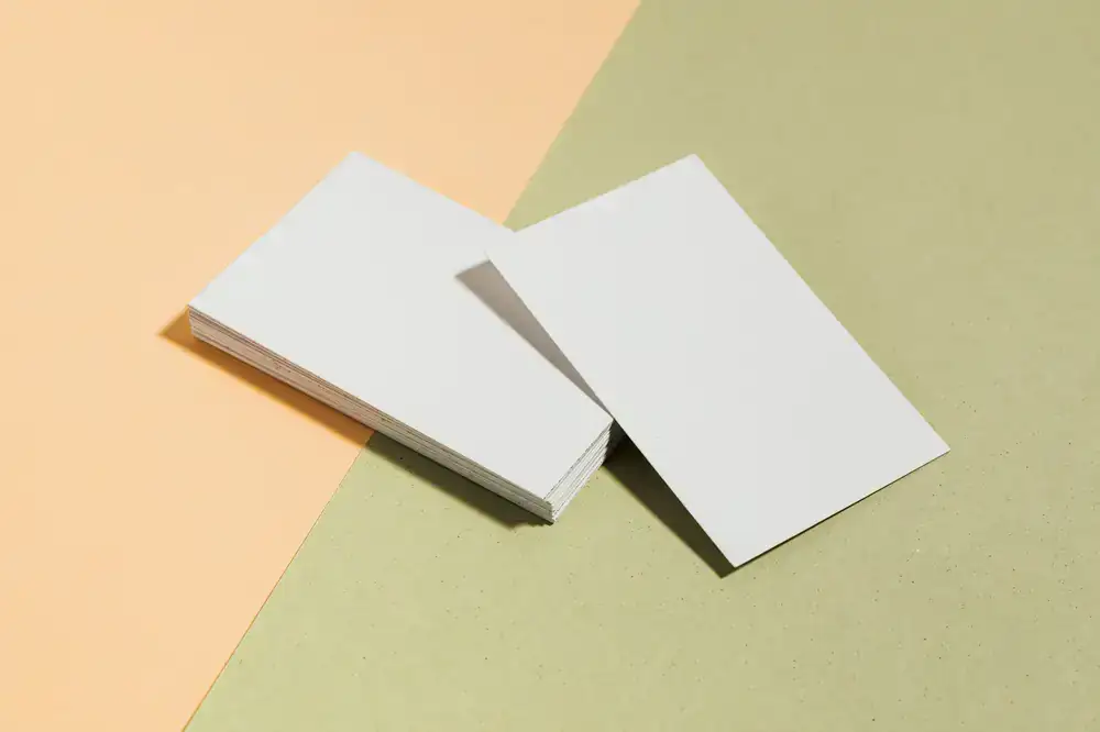 A neat stack of thick letterpress business cards with painted edges