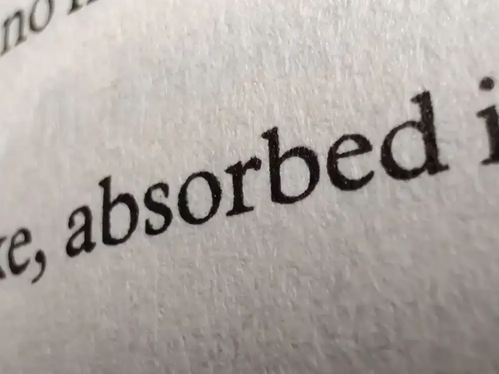 Close up of text pressed into paper without ink