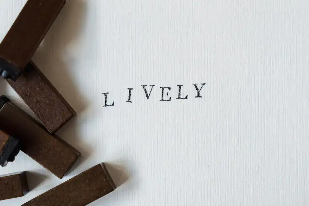 Close up of a vintage letterpress machine creating an impression on thick cotton paper